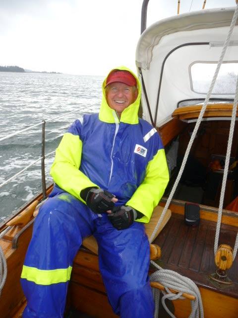 Sailor on a yacht in maryland wearing Stormline Captains rain gear for sailing
