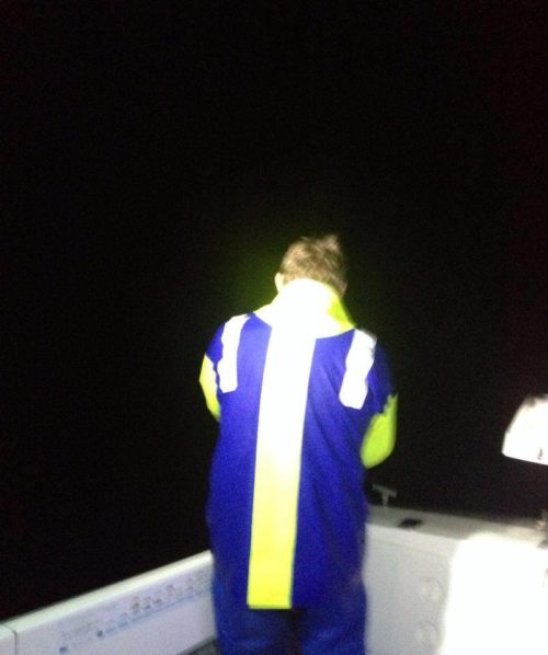 Night fishing in Australia wearing a wet weather jacket